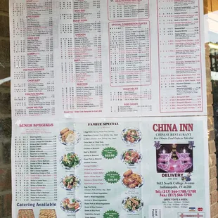 a menu on a brick wall