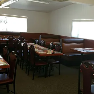 a restaurant with tables and booths