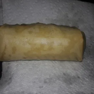 a rolled pastry on a napkin
