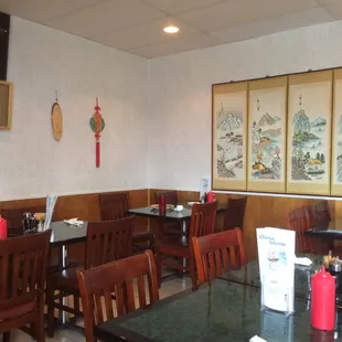 a dining area with tables and chairs