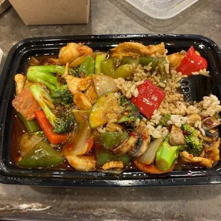 a tray of chicken and vegetables
