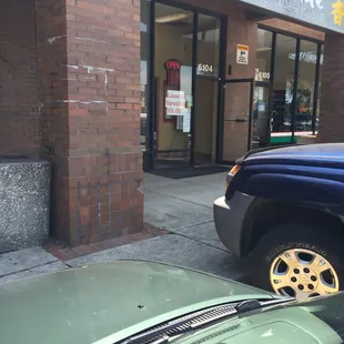 car parked in front of store