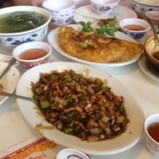 Small Hot Pepper Pork with Banh Xeo in the background