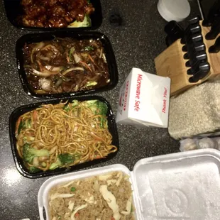 LTR: orange chicken, Mongolian beef, vegetable lo mein, chicken fried rice. I also got egg rolls but they were bland.