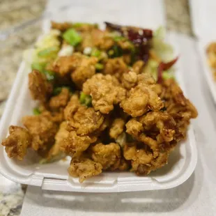 two takeout containers of food