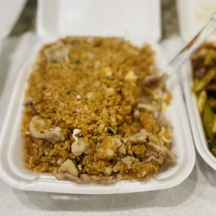 two takeout containers of food