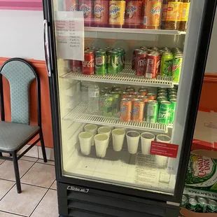 a refridgerator with drinks and beverages