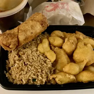 Sweet and Sour chicken combo with fried rice and an egg roll. Pretty good for carry out.