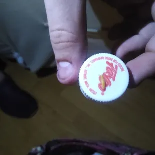 a person holding a button