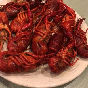 a plate of craws on a table