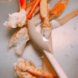 crab legs and claws with a fork