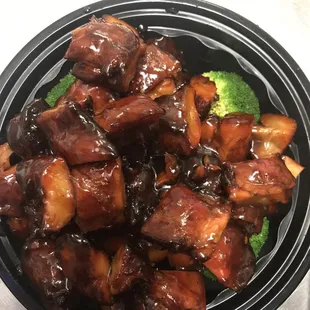 a bowl of meat and broccoli