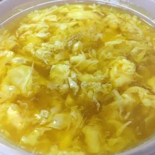 a bowl of soup with broccoli