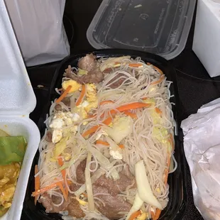 noodles, meat and vegetables in a plastic container