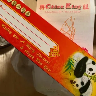 a pair of pandas sitting on a table