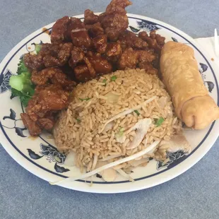 a plate of food with rice, meat, and vegetables