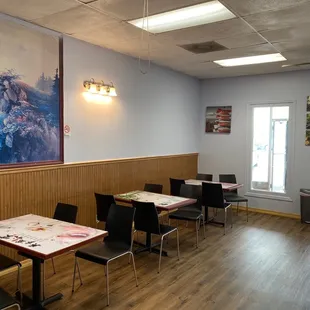 a dining room with tables and chairs