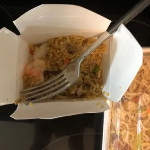 a fork in a take out container