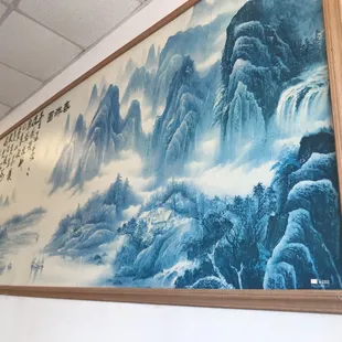 a painting on the wall of a restaurant