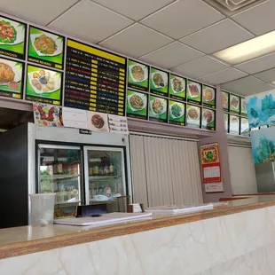 menus on the wall of the restaurant