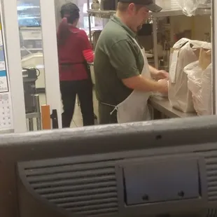 a man preparing food in a kitchen