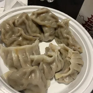 a plate of dumplings on a table