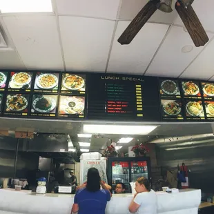 menus on the wall of the restaurant