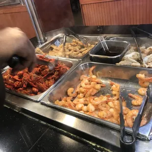 a buffet with a variety of food items