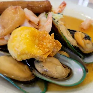 a plate of steamed mussels and shrimp