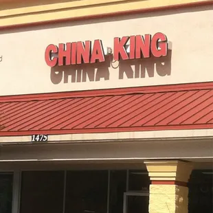 cars parked in front of a chinese restaurant