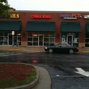 a car parked in front of the restaurant