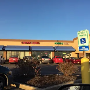 cars parked in front of a chinese restaurant