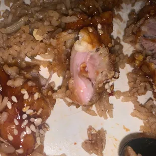 a plate of food with rice and meat