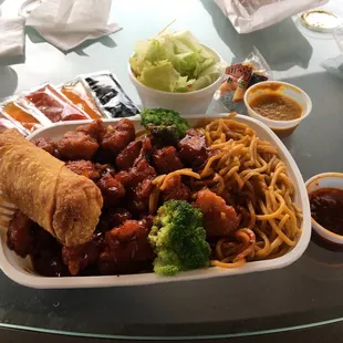 General Tso dinner with egg roll, salad with ginger dressing and lo mein. I always ask for hot pepper sauce on the side.