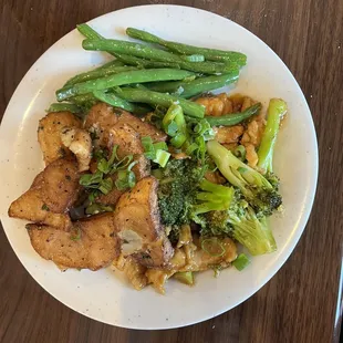a plate of chicken, broccoli and beans