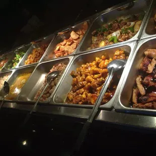 a variety of food items in a buffet