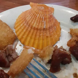 The shell from my crab cake. I like the variety here. Sweet corn nuggets,scallions,pudding and ice cream.