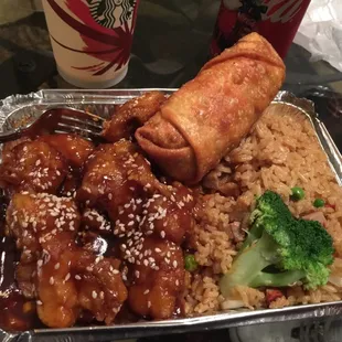 Sesame Chicken - that eggroll is hiding three fresh shrimp. Fresh, plump shrimp...