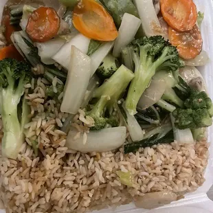 House vegetable dinner combination with chicken fried rice.
