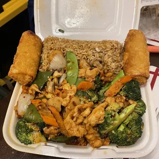 Szechuan chicken dinner combo with chicken fried rice and egg rolls.
