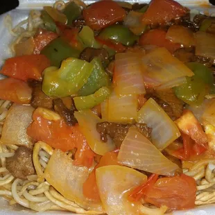 Tomato curry beef over noodles