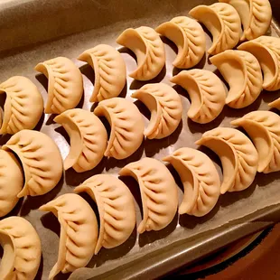 a tray of dumplings on a table