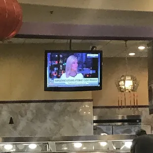 a flat screen tv in the kitchen