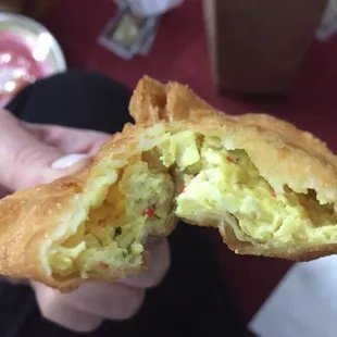 Crab Rangoon w/yellow filling?! Has curry in it. An unexpected surprise when you&apos;re craving regular white filling crab Rangoon.