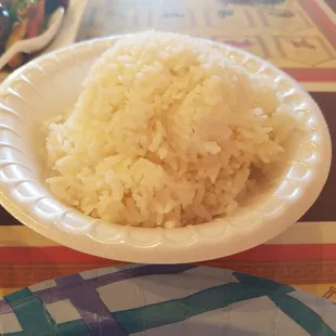 Rice served on Styrofoam  plate.