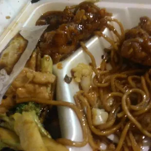 a plate of food with noodles and meat