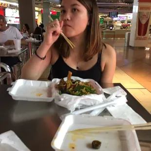a woman eating a meal at a restaurant
