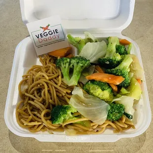a container of noodles and broccoli