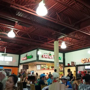 a large group of people eating at a restaurant