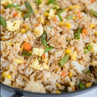 fried rice and vegetables in a skillet